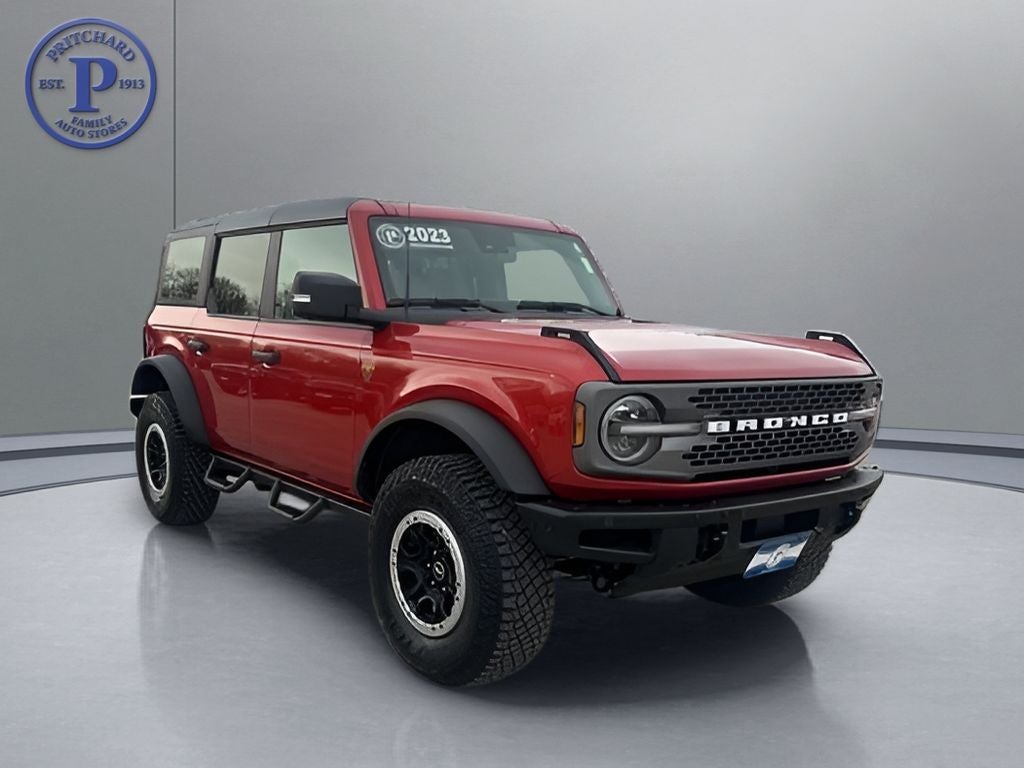 2023 Ford Bronco Badlands in Hot Pepper Red Metallic Tinted Clearcoat — front three-quarter view