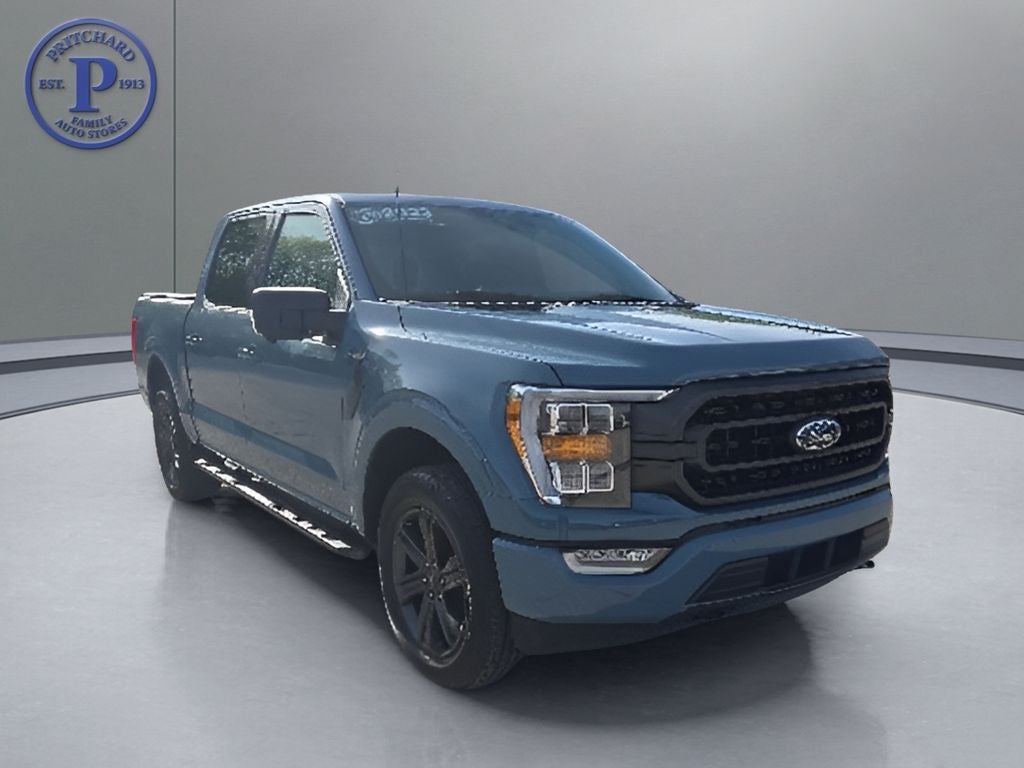 2023 Ford F-150 XLT in Area 51 Blue — front three-quarter view